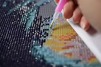 Placing diamonds on canvas for Create Your Own Diamond Painting Kit